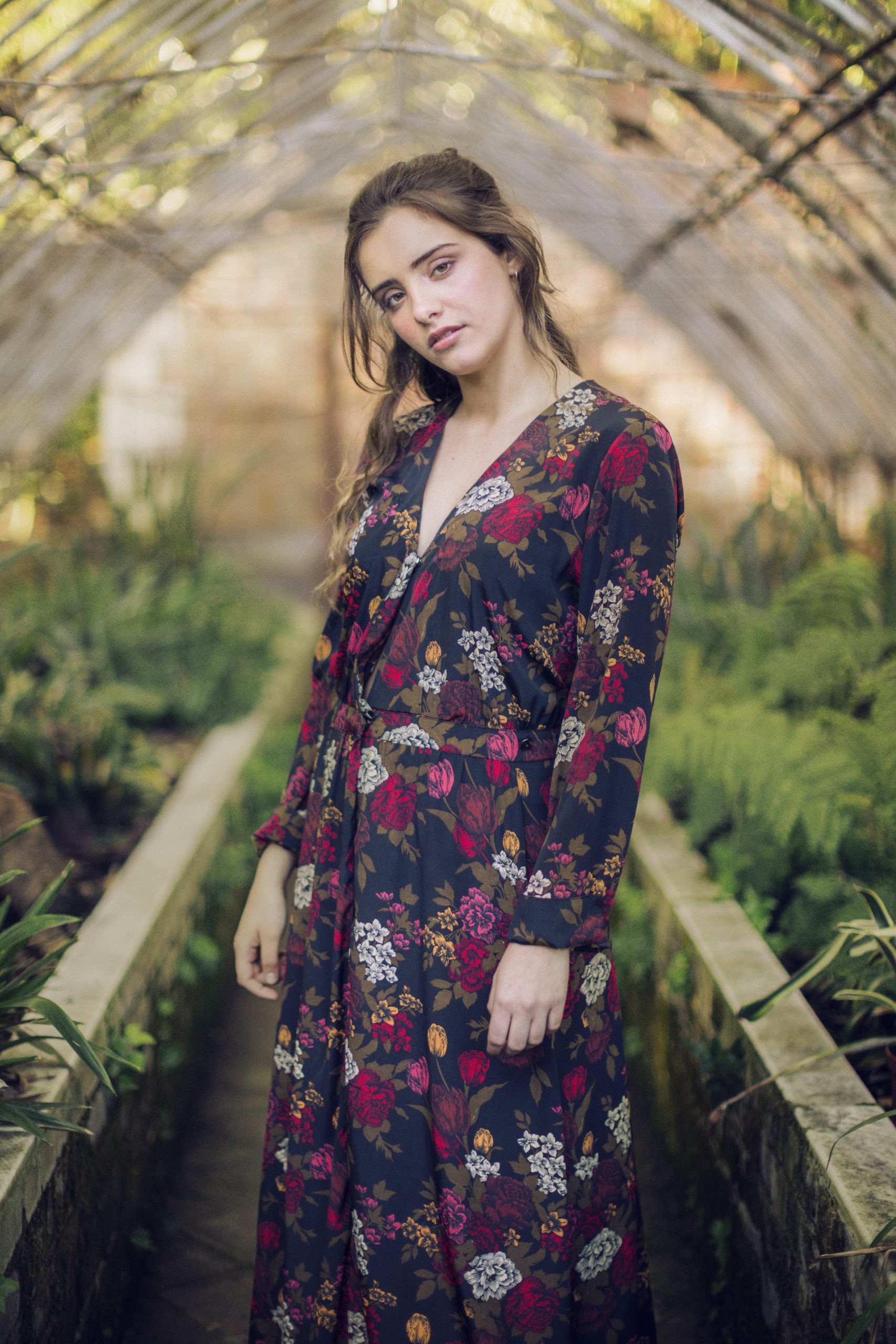 woman-floral-dress-looking-camera